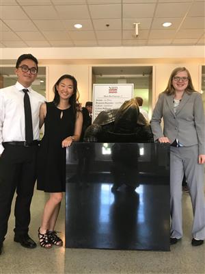 Students posing with turtle 